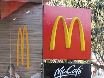 McDonald's tries to keep its head above water with cost cuts