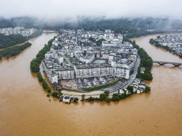 Hundreds of thousands evacuated in China after heaviest rains in decades