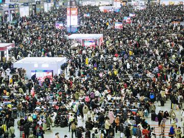Chinese endure New Year travel rush for a taste of home