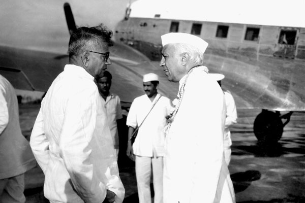 BRINGING UP INDIA: T.T. Krishnamachari in a chat with Jawaharlal Nehru at Meenambakkam airport in October 1955