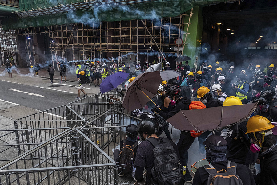 Alibaba postpones Hong Kong listing as protests roil markets