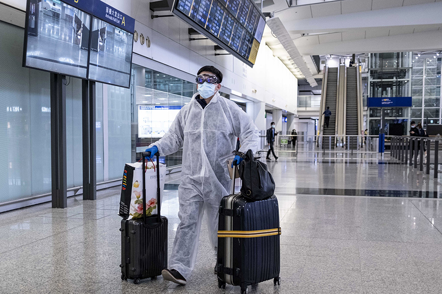 Goggles and Ponchos: Airport looks in the thick of a pandemic