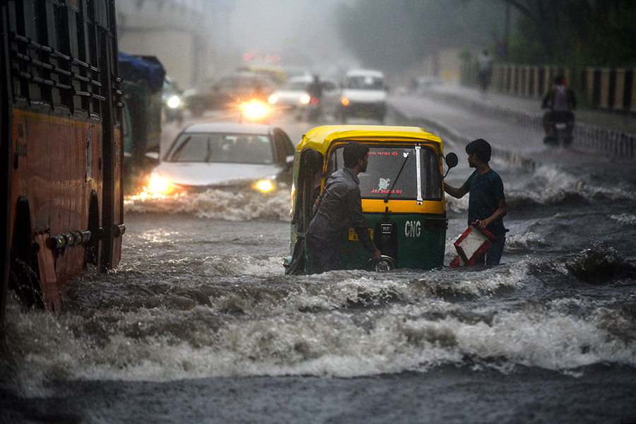 Photo of the day: Commuters battle water-logging in New Delhi