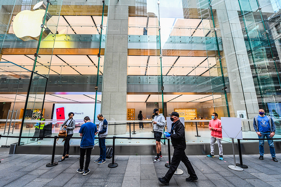 Photo of the Day: Customers queue outside the Apple store for new products, socially distanced
