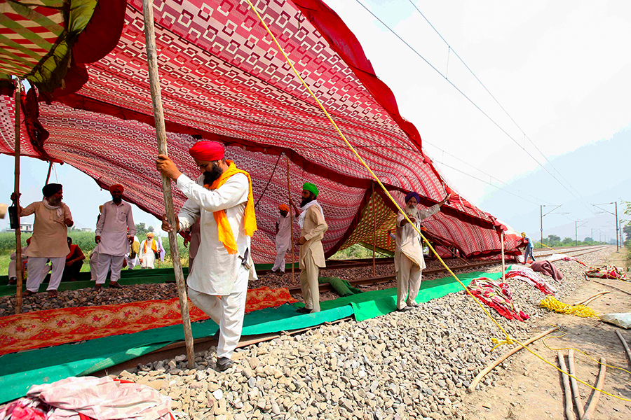 Photo of the Day: Farmers block rail tracks to protest farm bills, call for bandh