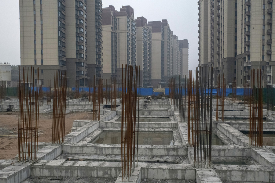 China's economy slowed late last year on real estate troubles