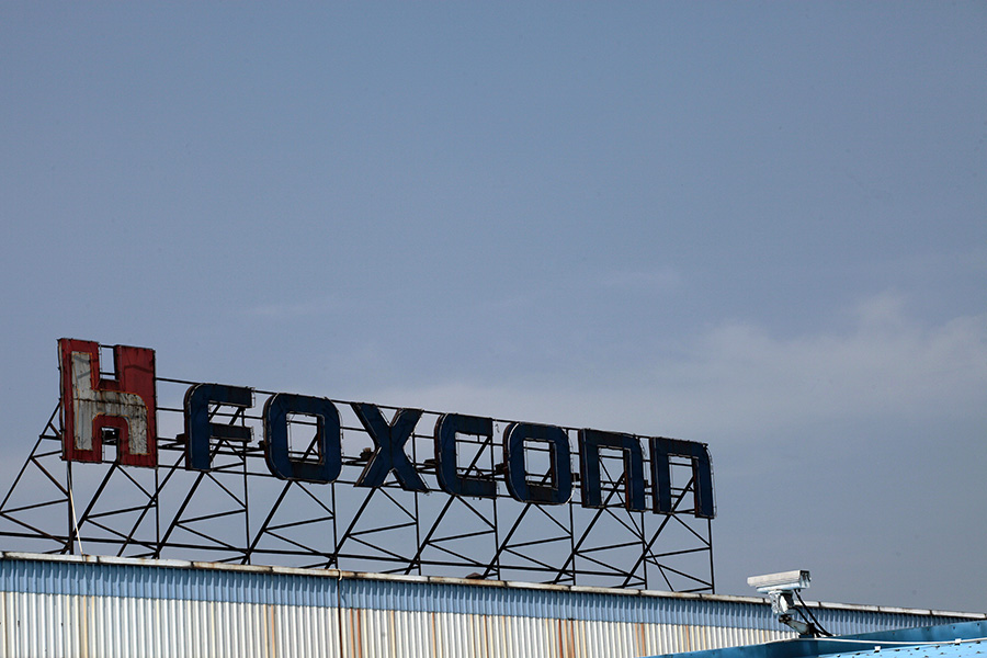Morning buzz: Foxconn plans India EV hub, Deloitte resigns as Adani Ports auditor, and more
